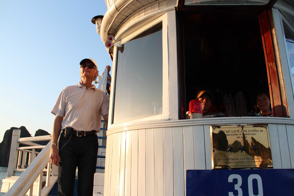 Bernard Weber, Founder-President of New7Wonders, pictured here taking a trip across Ha Long Bay, believes in a balance of environmental conservation and sustainable tourism.